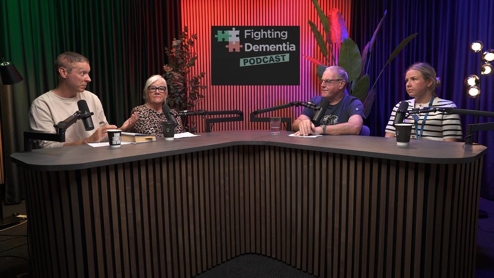 The hosts and guests around the studio desk